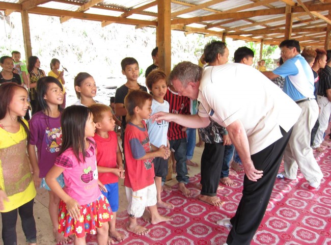 Classic propaganda pose as Torstein Sjotveit promotes his 'humanitarian mission' to make the lives of the Penan 'better'.