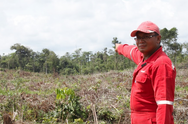 One villager points to the land in question