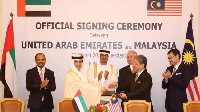 Happier days in March 2013 - Al Husseiny (left) and Al Qubaisi (2nd left) shake hands on a JV with 1MDB Chair Loden Wok Kamaruddin, who was today challenged to step down over money owed to the Army Veterens' Fund by 1MDB (Lodin is on the Board of both organisations)